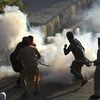 Người biểu tình ủng hộ cựu Thủ tướng Pakistan Imran Khan gây bạo loạn tại Peshawar ngày 9/5/2023. Ảnh: AFP/TTXVN