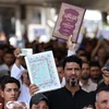 Người Hồi giáo Iraq tuần hành phản đối việc đốt kinh Koran bên ngoài Đại sứ quán Thụy Điển ở Nassiriyah, ngày 30/6/2023. (Ảnh: AFP/TTXVN)