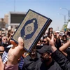 Biểu tình tại Kufa (Iraq) ngày 21/7/2023, phản đối hành vi đốt kinh Koran. (Ảnh: AFP/TTXVN)