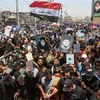 Biểu tình tại Sadr City, ngoại ô Baghdad (Iraq), ngày 21/7/2023, phản đối hành vi đốt kinh Koran ở Đan Mạch. (Ảnh: AFP/TTXVN)