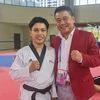 Võ sỹ Trần Hồ Duy (trái) chính thức có Huy chương Đồng nội dung Quyền Cá nhân Nam môn Taekwondo. (Nguồn: Thanh Niên)