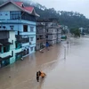 Nhiều ngôi nhà bị ngập trong nước lũ ở thung lũng Lachen, bang Sikkim, Ấn Độ, ngày 4/10/2023. Ảnh: AFP/TTXVN