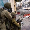 Binh sỹ quân đội Israel triển khai các cuộc tấn công trên bộ tại Gaza, ngày 22/12/2023. (Ảnh: AFP/TTXVN)