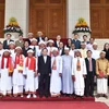 Phó Thủ tướng Trần Lưu Quang với các đại biểu. (Ảnh: An Đăng/TTXVN)