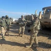 Binh sỹ Mỹ tham gia tập trận bắn đạn thật tại căn cứ Basmaya, phía Đông Nam Thủ đô Baghdad (Iraq). (Ảnh: AFP/TTXVN)