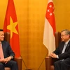 Phó Thủ tướng Lê Minh Khái tiếp Phó Thủ tướng Singapore Gan Kim Yong. (Ảnh: Nguyễn Tuyến/TTXVN)
