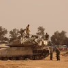 Binh sỹ và xe quân sự Israel được triển khai gần biên giới với Dải Gaza ngày 27/5/2024. (Ảnh: THX/TTXVN)