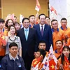 Thủ tướng Phạm Minh Chính với người lao động Việt Nam đang làm việc tại Hàn Quốc. (Ảnh: Dương Giang/TTXVN)