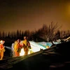 Lực lượng cứu hộ tìm kiếm nạn nhân sau một trận động đất tại Khu tự trị Tân Cương (Trung Quốc), ngày 23/1/2024. (Ảnh: THX/TTXVN)
