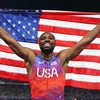 Noah Lyles ăn mừng chiến thắng giành huy chương Vàng ở nội dung chung kết 100m nam. (Nguồn: Getty Images/CNN)