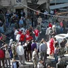 Hiện trường một vụ đánh bom xe ở Homs, ngày 24/10. (Nguồn: SANA)