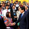 Chủ tịch nước Trương Tấn Sang gặp mặt thân mật 104 nhà giáo tiêu biểu trong cả nước. (Ảnh: Nguyễn Khang/TTXVN)