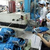 Giày dép là một trong những mặt hàng xuất khẩu chủ lực của Việt Nam sang Tây Ban Nha (Ảnh: Thanh Vũ/TTXVN)