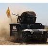 Xe quân sự của quân chính phủ Iraq trong cuộc giao tranh với IS ở Tikrit, tháng 3/2015. (Nguồn: AFP)