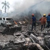 Hiện trường vụ rơi máy bay vận tải quân sự C-130 Hercules của không quân Indonesia ở thành phố Medan. (Nguồn: Reuters)