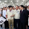 Chủ tịch nước Trương Tấn Sang thăm Nhà máy điện tử Samsung – Thái Nguyên (SEVT). (Ảnh: Nguyễn Khang/TTXVN)