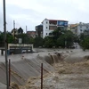 Khu vực trung tâm thành phố Uông Bí, tỉnh Quảng Ninh bị nước lũ dồn về làm ngập sâu, sáng 2/8. (Ảnh: Nguyễn Hoàng/TTXVN)