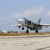 Máy bay ném bom Sukhoi Su-24 của Nga cất cánh từ căn cứ Hmeimim, tỉnh Latakia, Syria, ngày 3/10. (Nguồn: AFP)