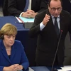 Thủ tướng Đức Angela Merkel và Tổng thống Pháp Francois Hollande phát biểu tại nghị viện châu Âu, ngày 7/10. (Nguồn: AFP)