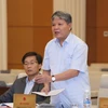 Bộ trưởng Bộ Tư pháp Hà Hùng Cường trình bày báo cáo tại phiên họp. (Ảnh: Phương Hoa/TTXVN)