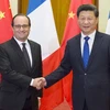 Chủ tịch Trung Quốc Tập Cận Bình đón Tổng thống Pháp Francois Hollande đang ở thăm Bắc Kinh. (Nguồn: THX)