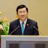 Chủ tịch nước Trương Tấn Sang báo cáo về đề nghị Quốc hội phê chuẩn Nghị định thư sửa đổi Hiệp định thành lập Tổ chức Thương mại Thế giới (WTO). (Ảnh: Doãn Tấn/TTXVN)