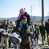 Người tị nạn ở biên giới Hy Lạp-Macedonia, ngày 13/11. (Nguồn: AFP)