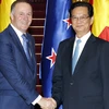 Thủ tướng Nguyễn Tấn Dũng đón, tiếp Thủ tướng New Zealand John Key. (Ảnh: Đức Tám/TTXVN)