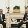 Tổng thống Nga Vladimir Putin hội đàm với người đồng cấp Pháp Francois Hollande, ngày 26/11. (Nguồn: AFP)