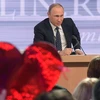Tổng thống Nga Vladimir Putin trả lời phỏng vấn báo chí tại cuộc họp báo. (Nguồn: Sputnik)