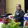 Tổng Bí thư Đảng Nhân dân Cách mạng Lào khóa X Bounnhang Volachith đọc diễn văn bế mạc. (Ảnh: Phạm Kiên/Vietnam+)
