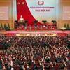 Các đại biểu biểu quyết thông qua Nghị quyết Đại hội XII Đảng Cộng sản Việt Nam. (Nguồn: TTXVN)