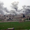 Cột khói bốc lên từ một khu dân cư ở thành phố Tel Abyad, Syria trong thời gian thực thi lệnh ngừng bắn, ngày 27/2. (Nguồn: AFP)