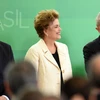 Tổng thống Dilma Rousseff (giữa), cựu Tổng thống Luiz Inacio Lula da Silva và tân Bộ trưởng Tư pháp Eugenio Aragão (trái) tại Brasilia. (Nguồn: AFP/TTXVN)