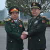 Đại tướng, Bộ trưởng Quốc phòng Phùng Quang Thanh đón Thượng tướng, Bộ trưởng Thường Vạn Toàn. (Ảnh: Trọng Đức/TTXVN) 