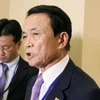 Bộ trưởng Tài chính Nhật Bản Taro Aso (phải) tại Hội nghị thường niên của IMF và WB ở Washington, DC ngày 14/4. (Nguồn: Kyodo/TTXVN) 