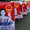 Tranh cổ động bầu cử đại biểu Quốc hội khóa XIV và Hội đồng nhân dân các cấp được tuyên truyền đến người dân Thành phố Hồ Chí Minh. (Ảnh: Mạnh Linh/TTXVN)