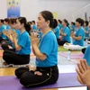 Đồng diễn Yoga hưởng ứng Ngày Quốc tế Yoga tại Thành phố Hồ Chí Minh, ngày 18/6. (Ảnh: Thanh Vũ/TTXVN)