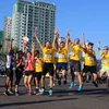 Niềm vui của các vận động viên Việt Nam sau khi hoàn thành cuộc thi marathon quốc tế 21km. (Ảnh: Trần Lê Lâm/TTXVN)