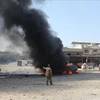 Hiện trường một vụ nổ ở một khu công nghiệp tại Idlib, Syria, ngày 14/8. ( Nguồn: Anadolu) 
