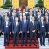 Chủ tịch nước Trần Đại Quang chụp ảnh chung với các đại biểu. (Ảnh: Nhan Sáng/TTXVN)