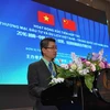 Đại diện Đại sứ quán Việt Nam tại Trung Quốc, Tham tán Công sứ Nguyễn Đắc Thành phát biểu tại hội thảo. (Nguồn: PX Bắc Kinh)