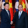 Thủ tướng Nguyễn Xuân Phúc đón, hội đàm với Thủ tướng Lào Thongloun Sisoulith. (Ảnh: Thống Nhất/TTXVN)