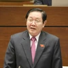 Bộ trưởng Bộ Nội vụ Lê Vĩnh Tân trả lời chất vấn. (Ảnh: Phương Hoa/TTXVN)