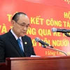 Ông Trần Văn Thọ, Chủ tịch Hội người Việt Nam tại tỉnh Khammoun, Trung Lào đọc báo cáo tại Hội nghị. (Ảnh: Phạm Kiên/TTXVN)