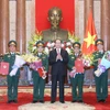Chủ tịch nước Trần Đại Quang trao Quyết định thăng quân hàm từ Trung tướng lên Thượng tướng cho 4 sỹ quan quân đội. (Ảnh: Nhan Sáng/TTXVN)