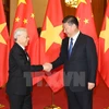 Tổng Bí thư, Chủ tịch nước Trung Quốc Tập Cận Bình đón Tổng Bí thư Nguyễn Phú Trọng trong chuyến thăm chính thức Trung Quốc. (Ảnh: Trí Dũng/TTXVN)