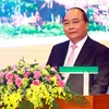 Thủ tướng Nguyễn Xuân Phúc phát biểu chỉ đạo tại Hội nghị xúc tiến đầu tư, thương mại và du lịch tỉnh Tuyên Quang 2017. (Ảnh: Thống Nhất/TTXVN)