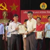 Ông Trần Văn Thuật (bên phải), Ủy viên Đoàn Chủ tịch, Trưởng Ban Tổ chức Liên đoàn Lao động Việt Nam. (Ảnh: Mạnh Minh/TTXVN)