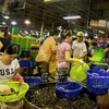 Khu vực kinh doanh các mặt hàng thủy hải sản tươi sống của chợ Bình Điền. (Nguồn: Báo Ảnh Việt Nam)